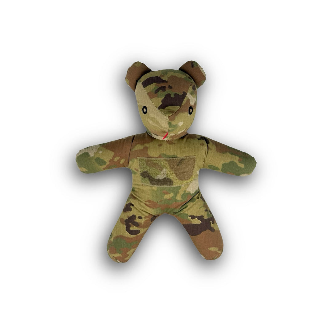 Camouflage-patterned teddy bear on a white background