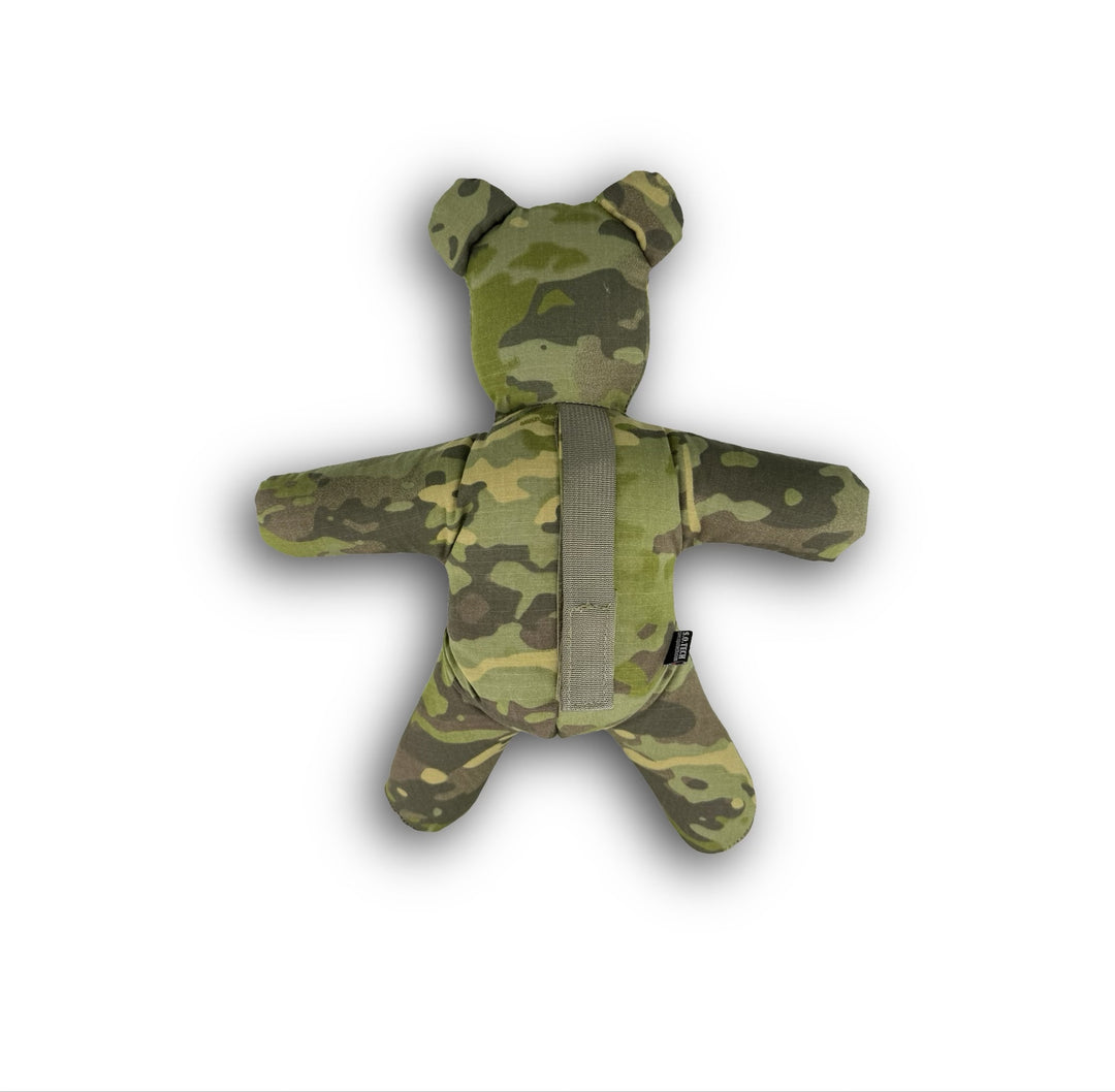 Camouflage-patterned teddy bear on a white background
