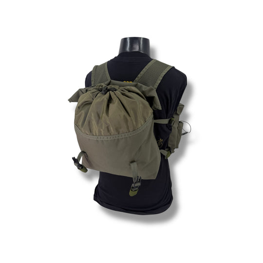 Green backpack on a mannequin with a white background